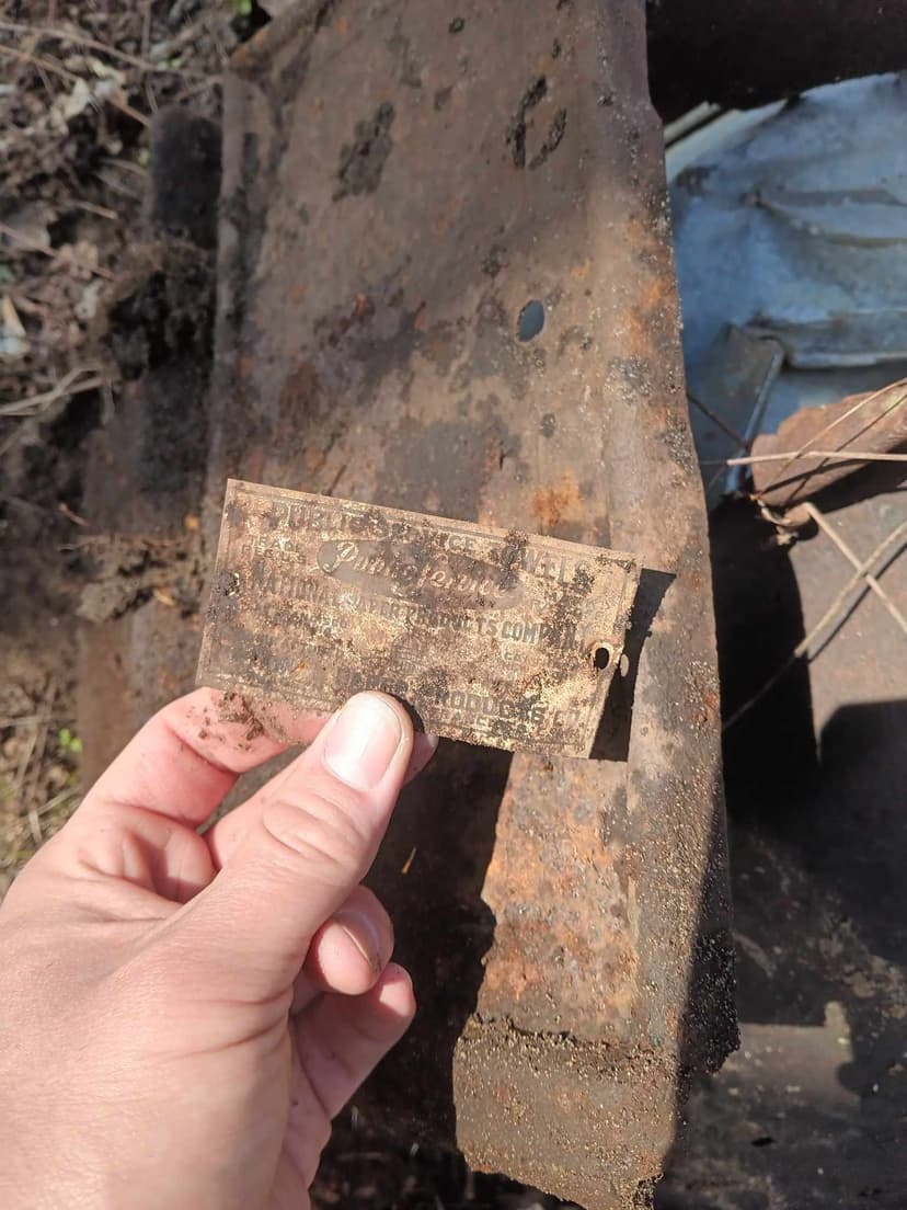 The rusted nameplate from some past person's lunchbox, toolbox, or similar.